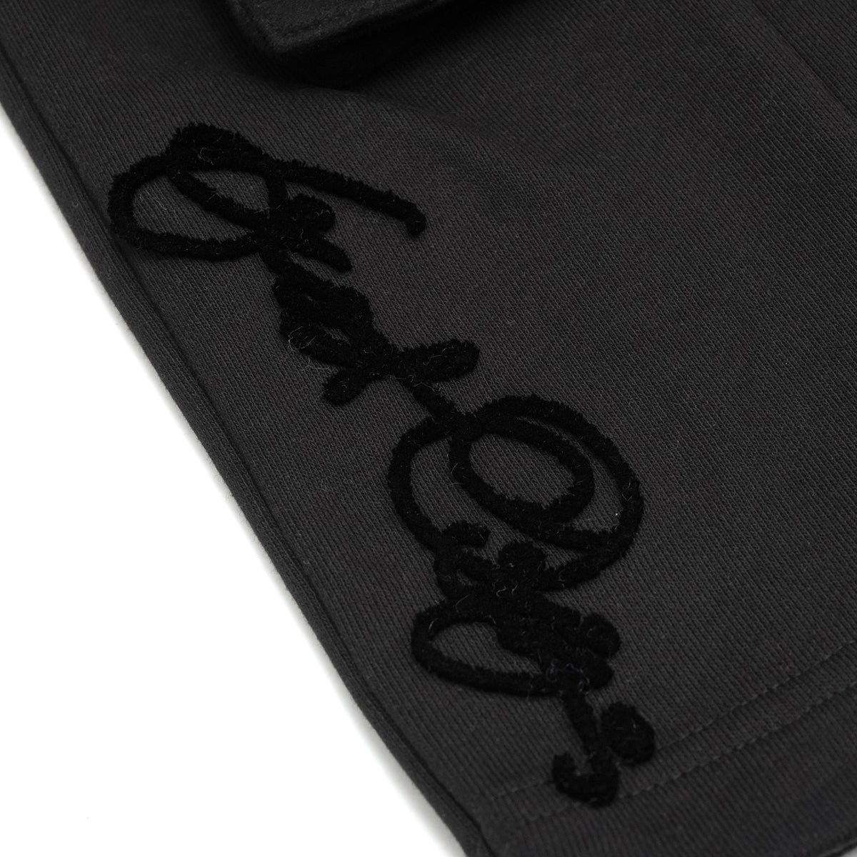 Makobi F677 Frost Essential Fleece Shorts in Black, detail view.