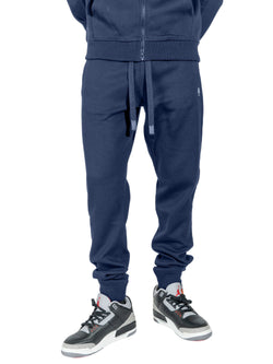 Makobi Essential Fleece Jogger Pants in navy, styled on a model, front